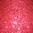 fabric with red flowers and sequins - Fabric Universe