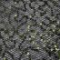 Green sequins on black spider mesh fabric - Fabric Universe