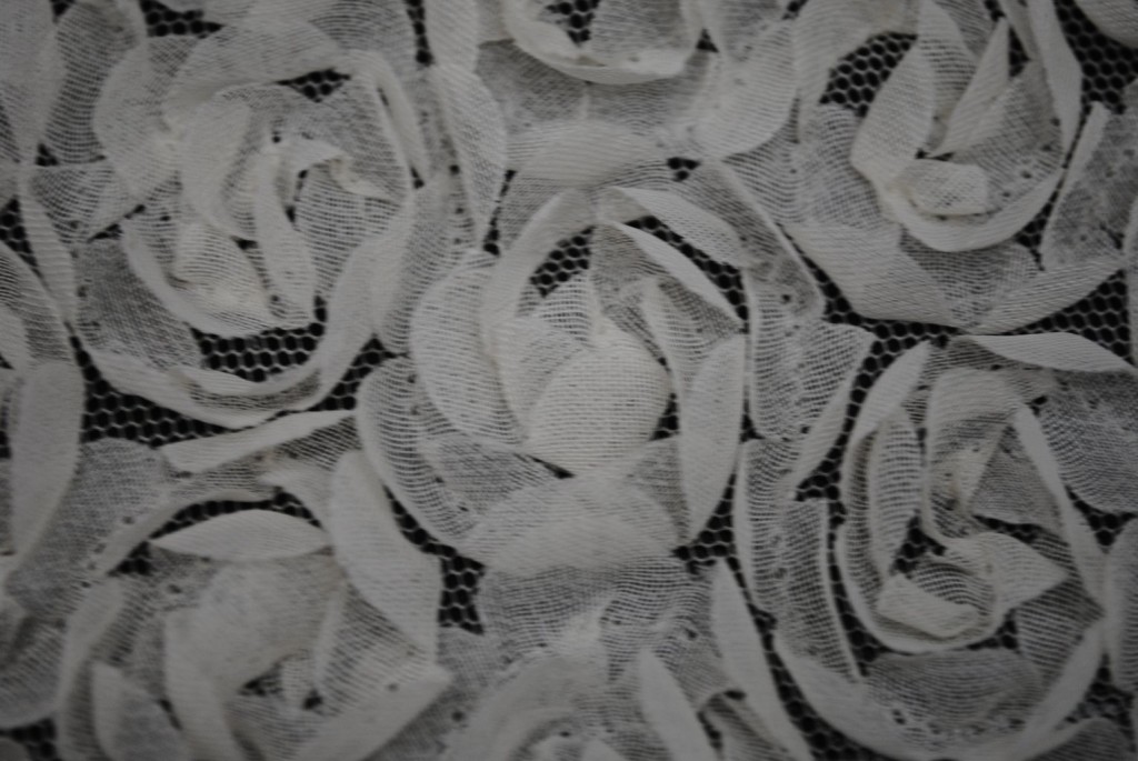Ivory baby flowers on mesh fabric - Fabric Universe