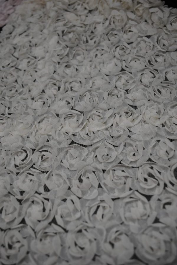 Ivory baby flowers on mesh fabric - Fabric Universe