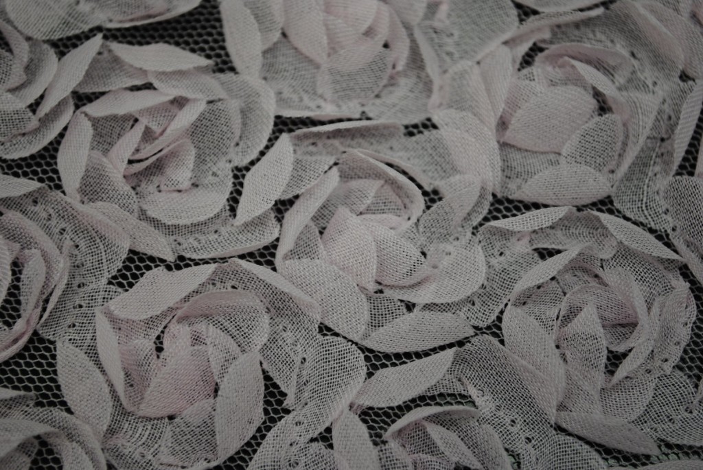 Pink baby flowers on mesh ground fabric - Fabric Universe