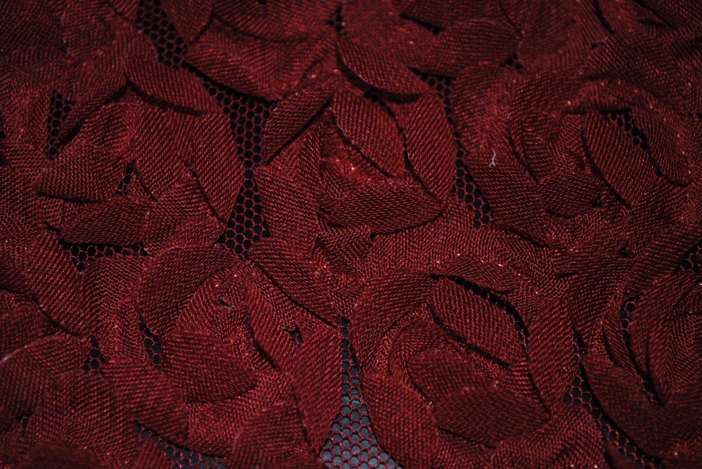 Red baby flowers on mesh ground fabric - Fabric Universe